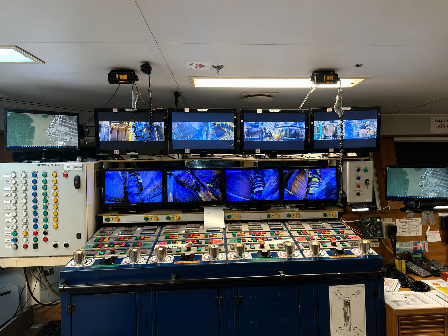 ROV control console with banks of live subsea camera and survey monitors